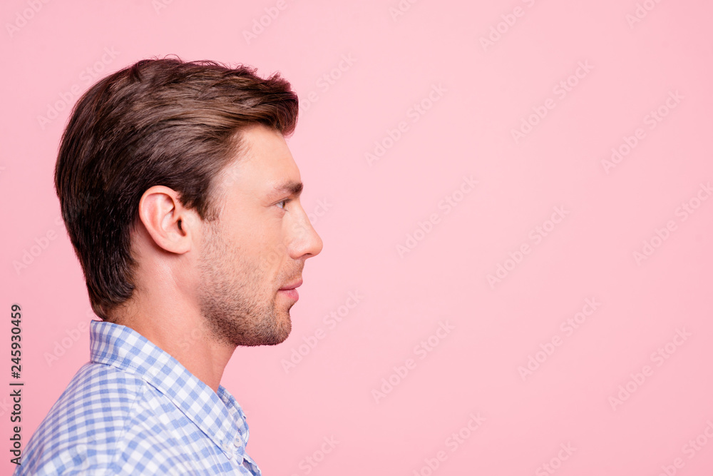 Fototapeta premium Close up side profile photo of pretty attractive he him his man relaxed watching to empty space ideal appearance wearing casual shirt outfit isolated on pale rose background