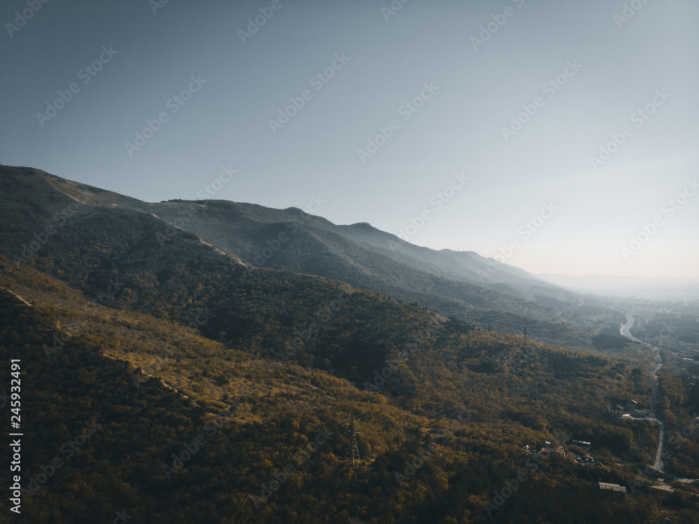 Aerial mountain panoramic landscape, range of hills in dusk, journey and hiking concept