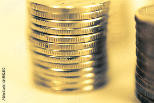 Stack of coins macro. Rows of coins for finance and banking concept. Economy trends background for business idea.