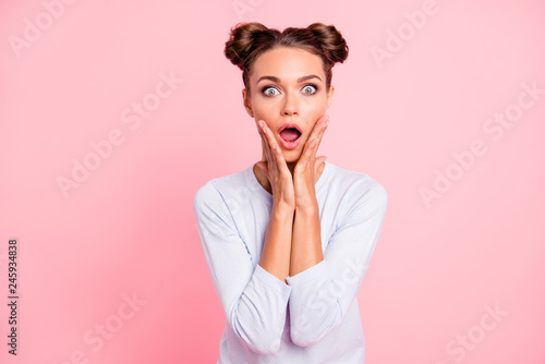 Portrait of her she nice lovely attractive cheerful amazed girl with buns wow great astonishing news opened mouth isolated over pink pastel background