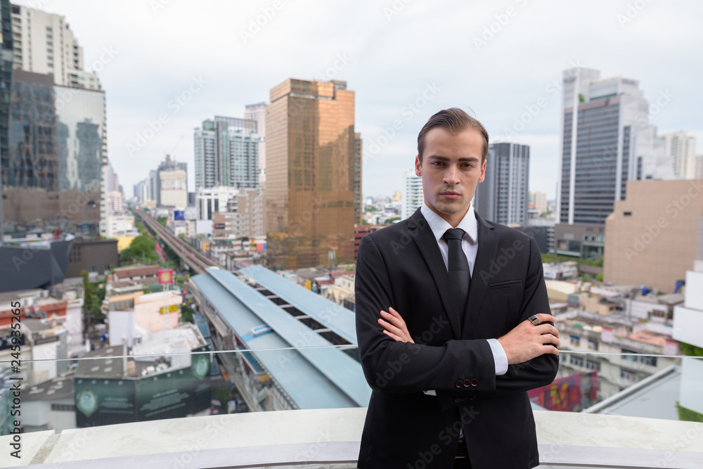 Young businessman exploring the city of Bangkok, Thailand Young businessman exploring the city of Bangkok, Thailand