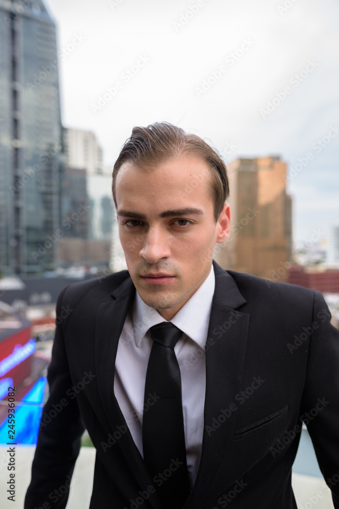 Young businessman exploring the city of Bangkok, Thailand Young businessman exploring the city of Bangkok, Thailand