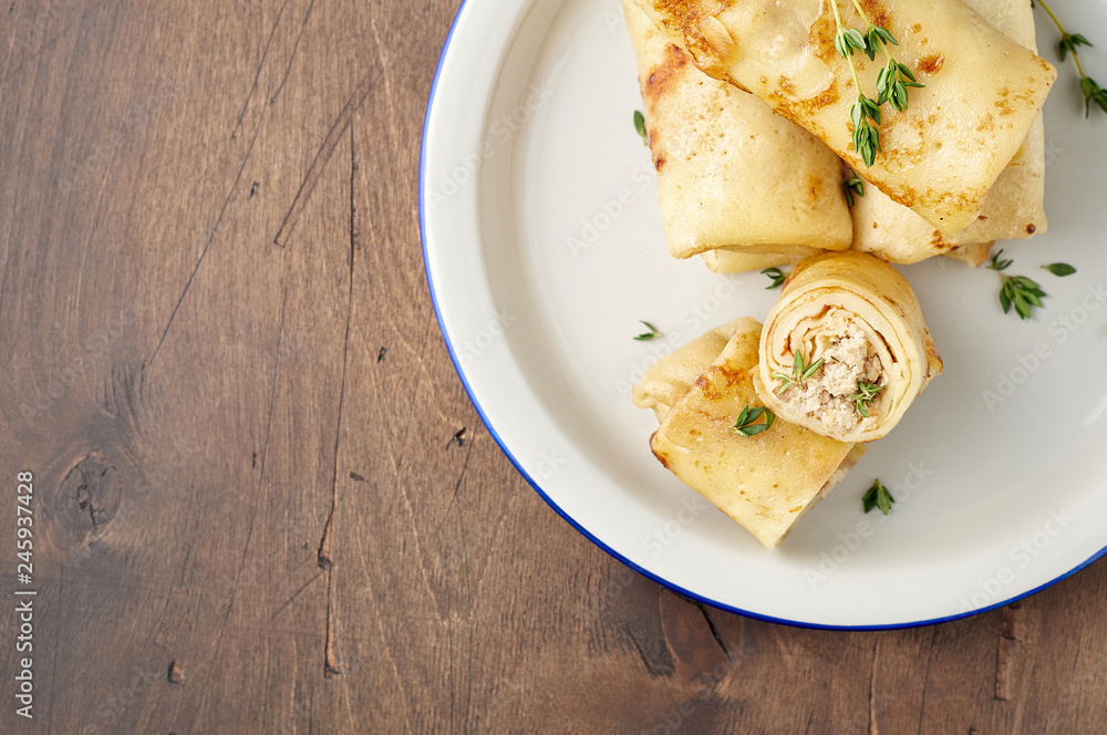 Savory crepe rolls with ground meat filling. Traditional Russian Shrovetide festival meal