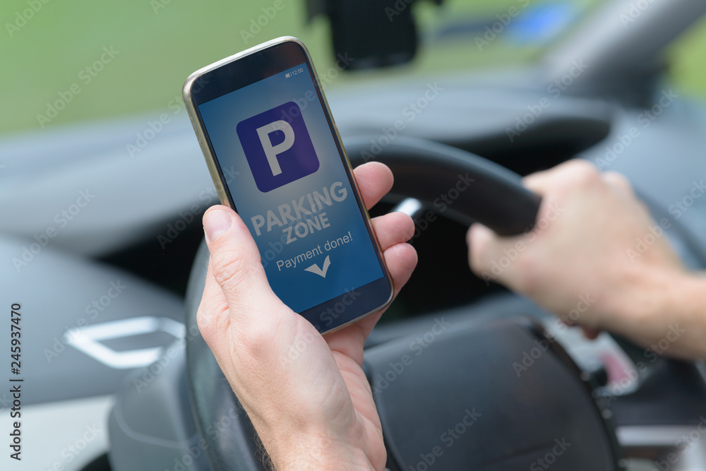 Driver using smartphone app to pay for parking