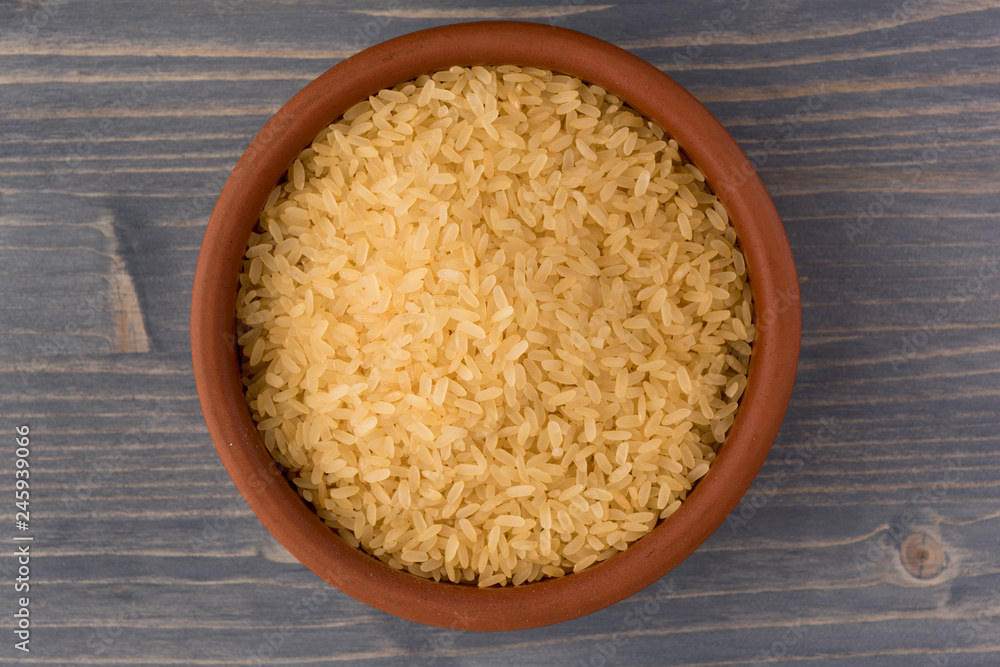 white rice in bowl on wooden table background white rice in bowl on wooden table background