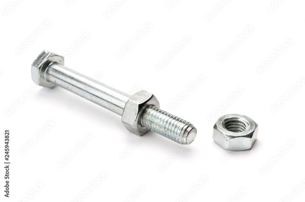 Nuts and bolt on white background. Selective focus. Nuts and bolt on white background. Selective focus.