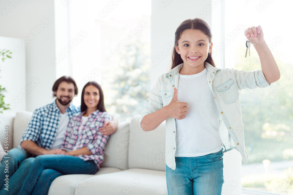 Welcome to new life Portrait of nice cute lovely attractive cheerful cheery people girl showing keys thumbup realestate room advert ad advice in modern white light interior room indoors Welcome to new life Portrait of nice cute lovely attractive cheerful cheery people girl showing keys thumbup realestate room advert ad advice in modern white light interior room indoors