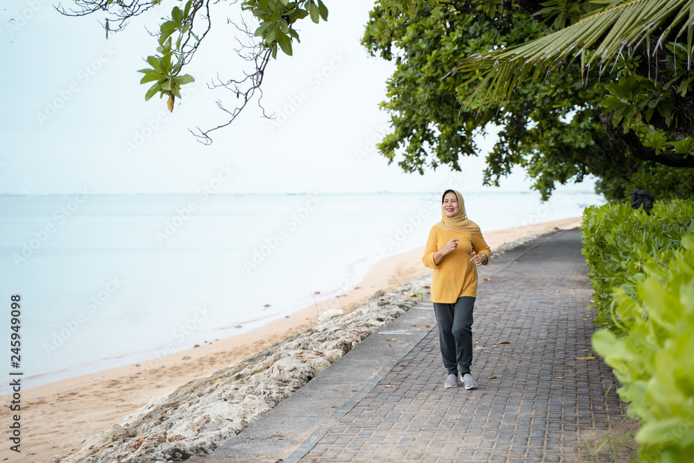 woman running and doing sport outdoor