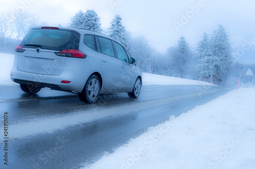 Car driving in bad weather winter conditions
