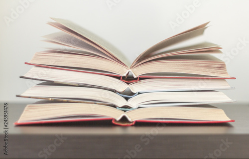 several open books on the table