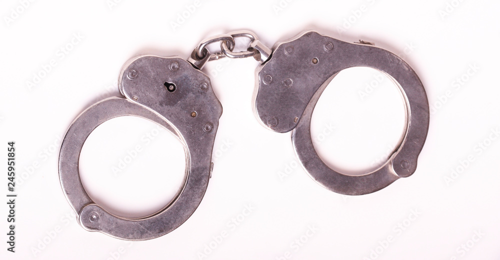handcuffs on white background. handcuffs on white background.