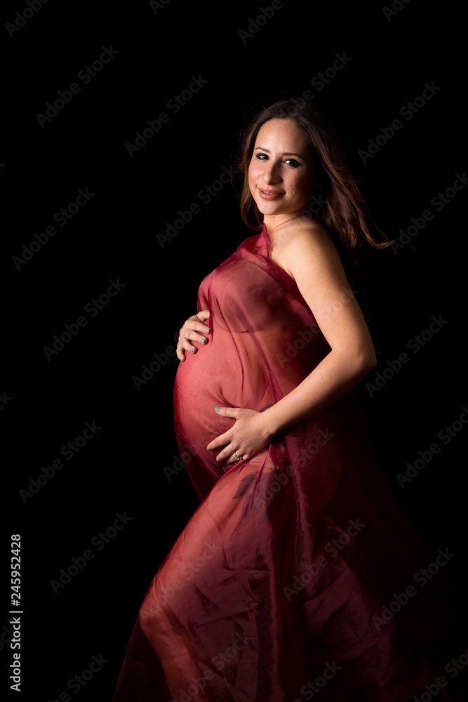 MS CS Pregnant woman in robe in studio MS CS Pregnant woman in robe in studio