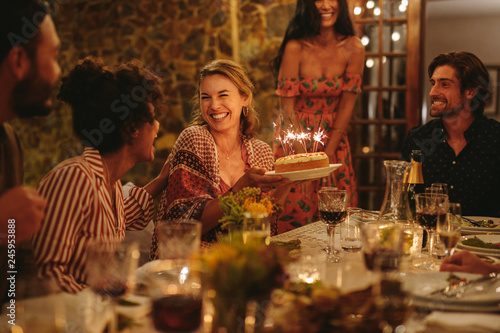 Bild auf Leinwand Beautiful woman celebrating her birthday with her friends
