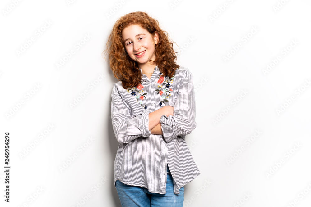 Beautiful readhead girl with on studio white background Beautiful readhead girl with on studio white background