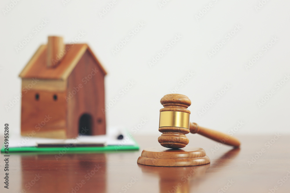 Property auction, Gavel wooden and model house on white background, lawyer of home real estate and ownership property concept Property auction, Gavel wooden and model house on white background, lawyer of home real estate and ownership property concept