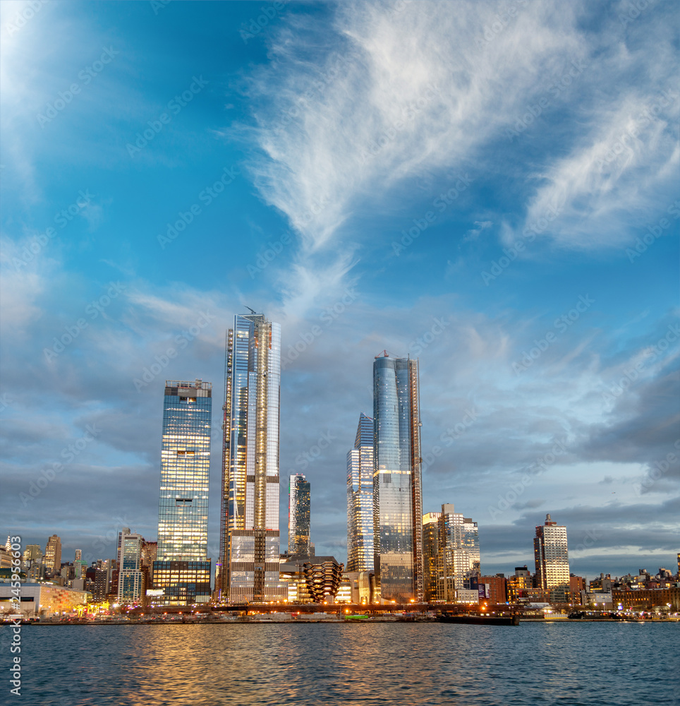 Hudson Yards Midtown Manhattan skyscrapers as seen from cruise ship at dusk