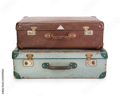 Two old vintage suitcases on white background, contains clipping path