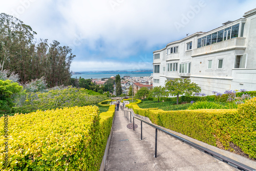SAN FRANCISCO, CA - AUGUST 5, 2017: Lyon Street Steps with tourists. These homes are a famous tourist attraction
