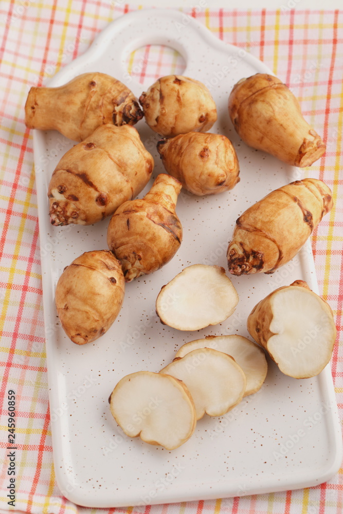 Jerusalem artichokes on a cutting board Jerusalem artichokes on a cutting board