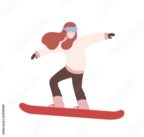 Smiling girl in snowsuit snowboarding