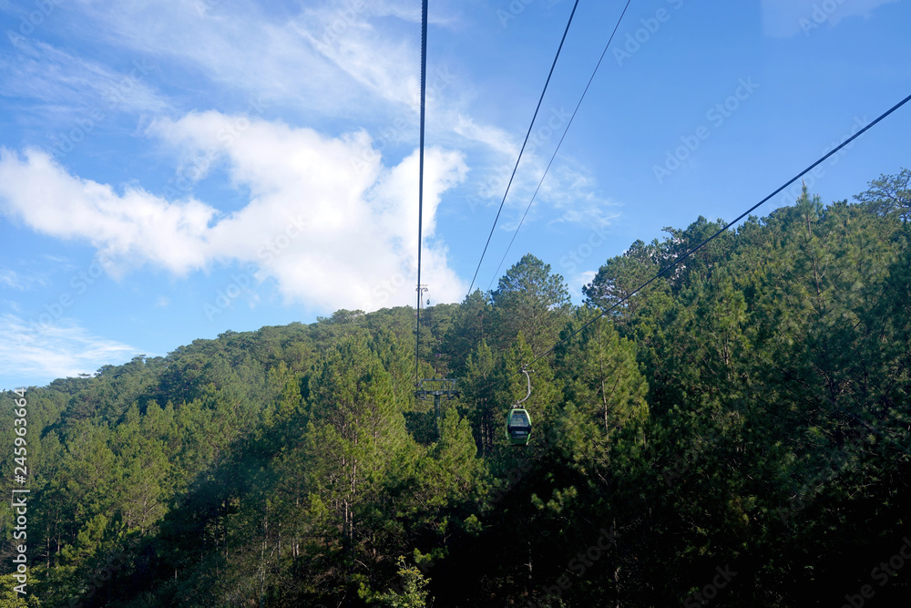 Dalat Cable Car, Route from Robin Hill to Truc Lam Monastery (Chua Truc Lam), at Robin Hill, Dalat, Vietnam. pine forest.