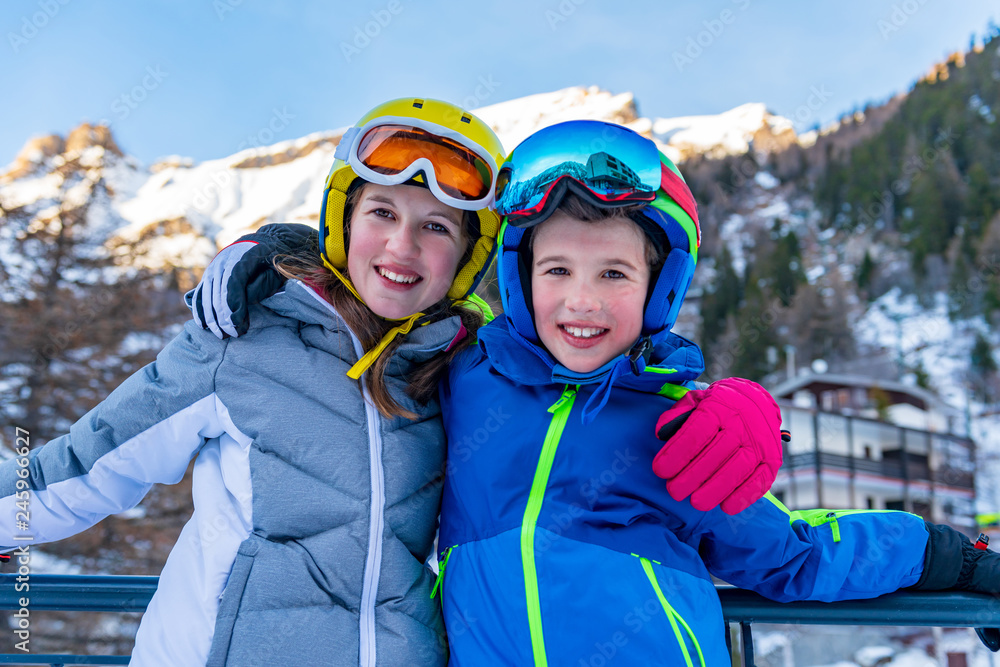 Portrait of little skiers laughing