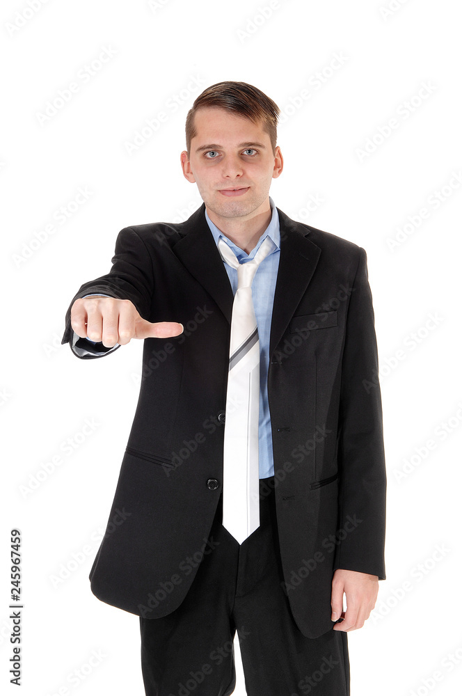 A young man standing with his thump down A young man standing with his thump down