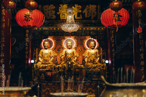 Three budhas interior of a chinese temple in Bangkok photo