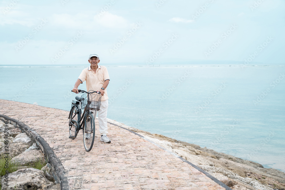 Fototapeta premium senior male riding a bicycle