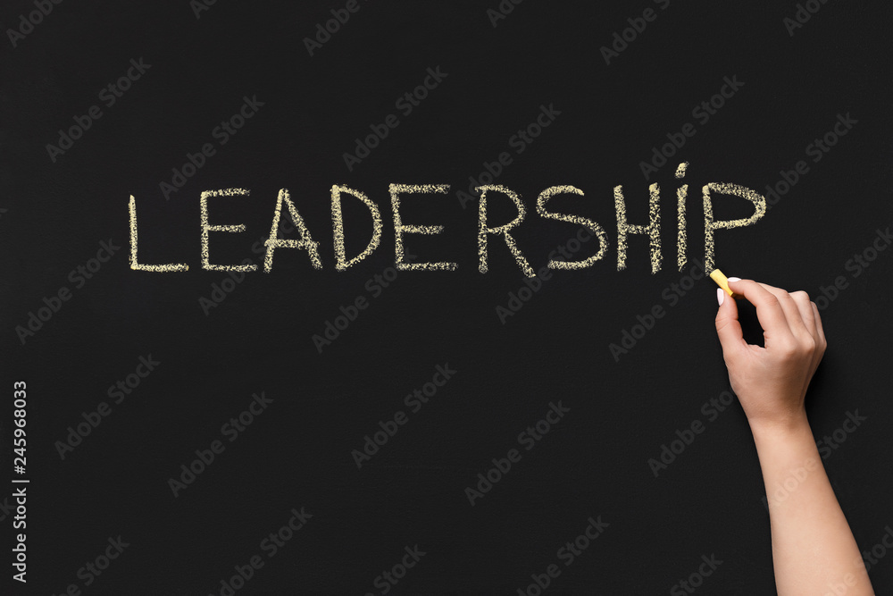 Word Leadership written with white chalk on blackboard