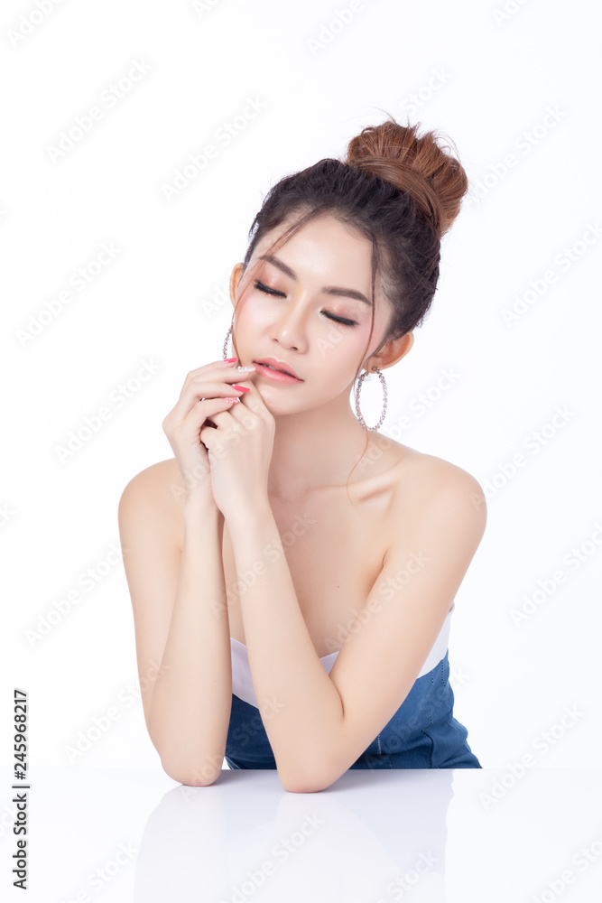 Portrait of attractive asian woman sitting smiling on white background. Healthy skin woman natural makeup beauty face concept. Using as your Product. Portrait of attractive asian woman sitting smiling on white background. Healthy skin woman natural makeup beauty face concept. Using as your Product.