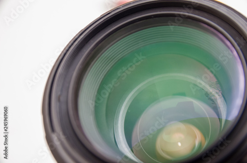 Photo lens or video lens close up on white background, goal, concept for photographer, cameraman, job, search for photographer, journalist, videographer for work. Photo lens repair