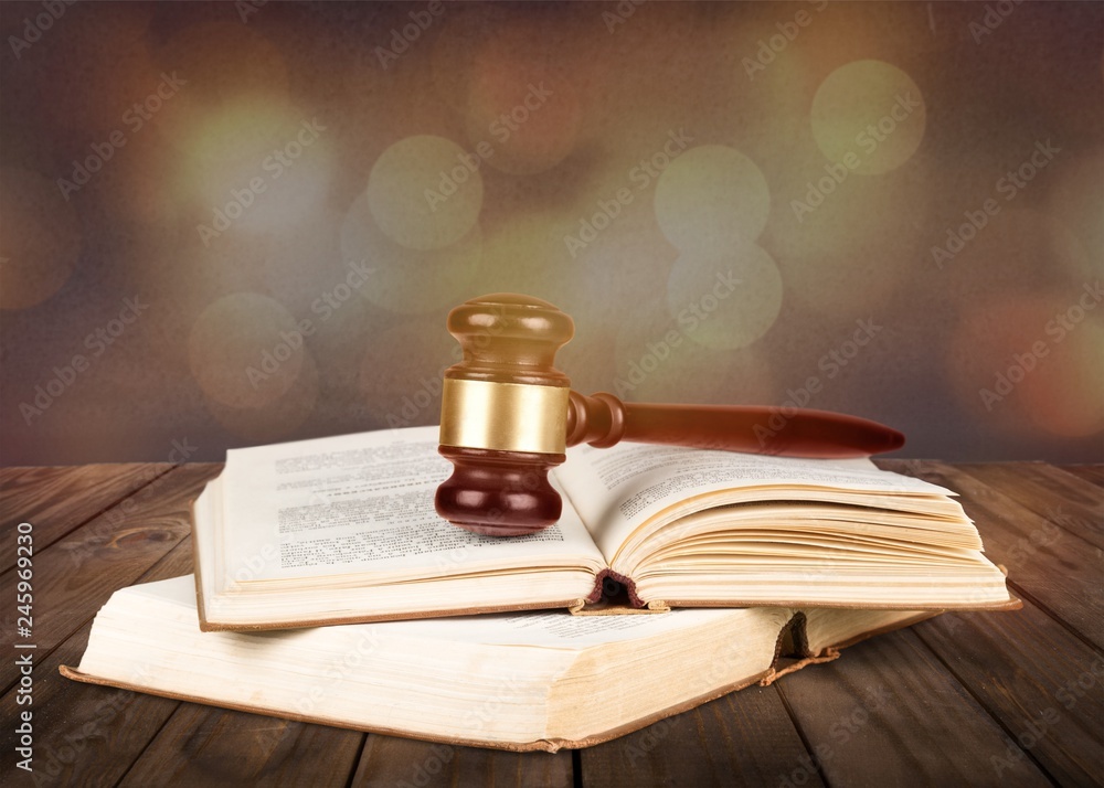 Books and wooden gavel on table. Justice concept Books and wooden gavel on table. Justice concept