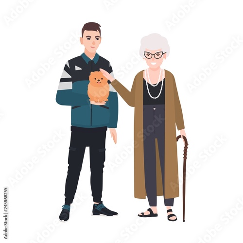Grandson and grandmother petting little dog. Family portrait of old lady and ...