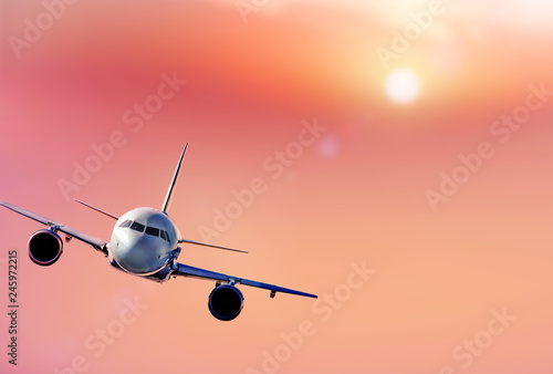 Jet-plane fly above beautiful clouds. Flying white airplane