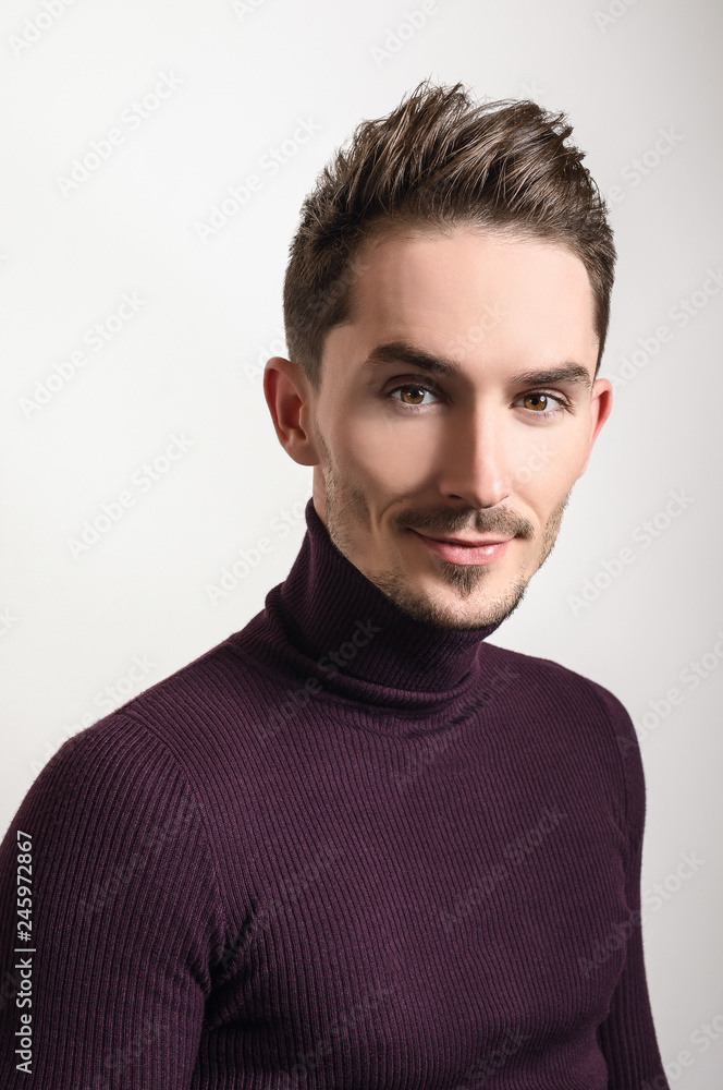 Fototapeta premium Handsome young elegant man in violet golf.