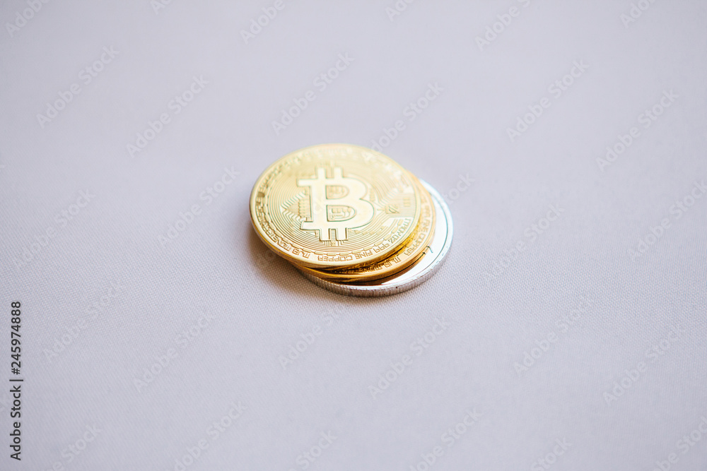Set of coins bitcoin and other cryptocurrency on a white background. Bitcoin is higher than other coins. Modern electronic payment instrument. Set of coins bitcoin and other cryptocurrency on a white background. Bitcoin is higher than other coins. Modern electronic payment instrument.