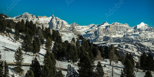 Panoramic snowy landscape of Val Badia valley in the Dolomites, South Tyrol, Italy seen from Gardena pass