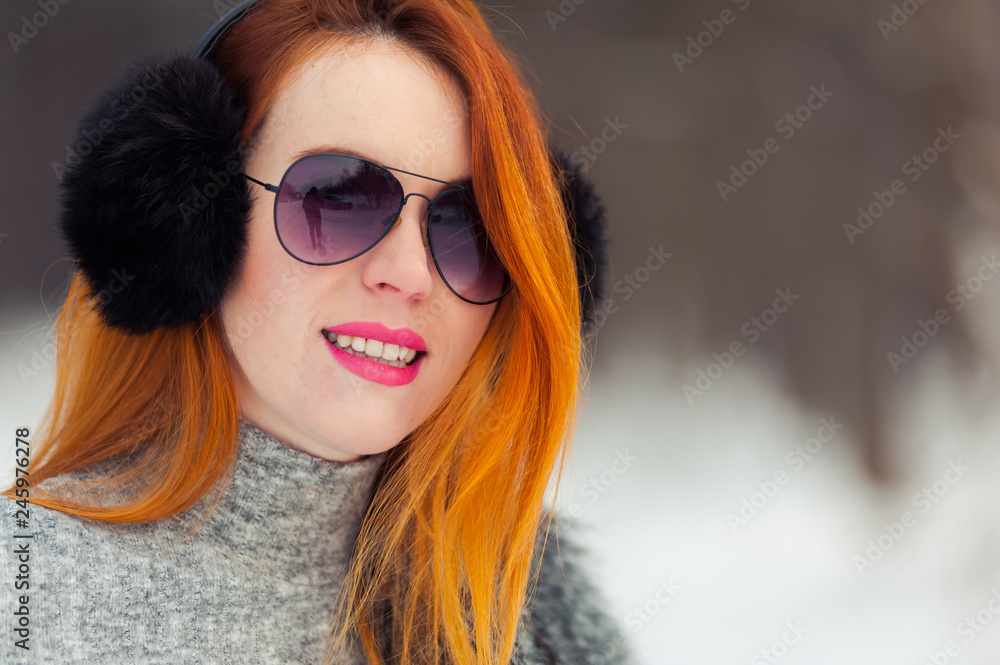 Portrait of beautiful red hat woman in the winter forest Portrait of beautiful red hat woman in the winter forest