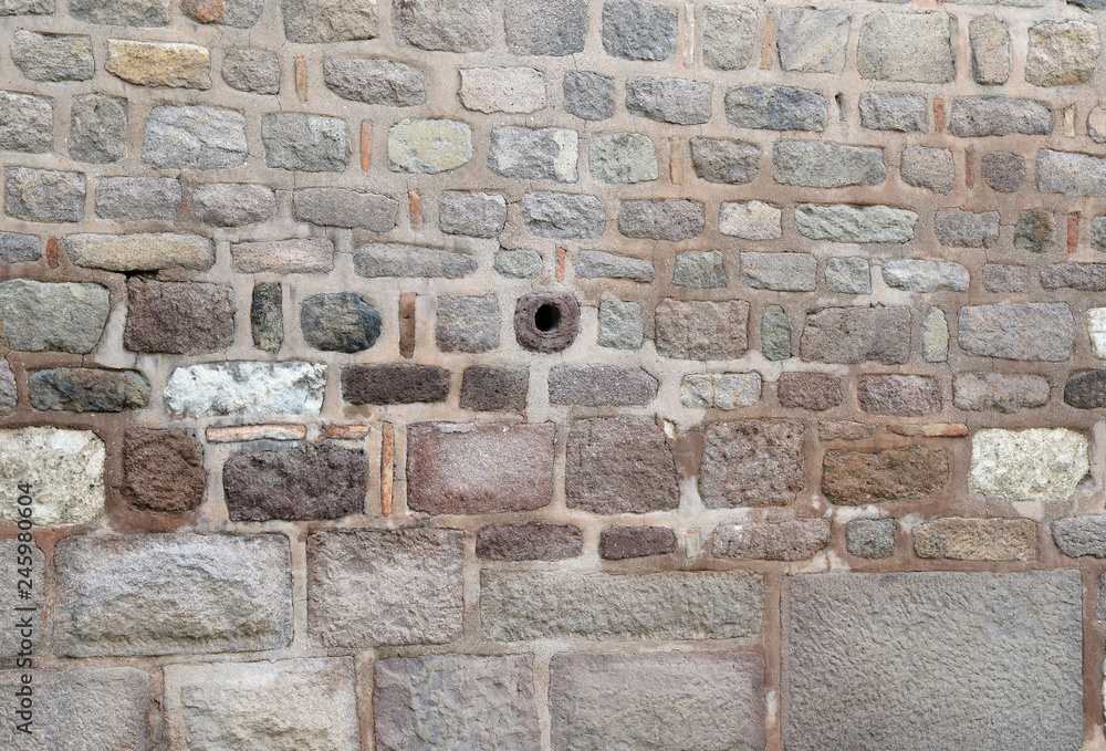 old stone wall of bricks