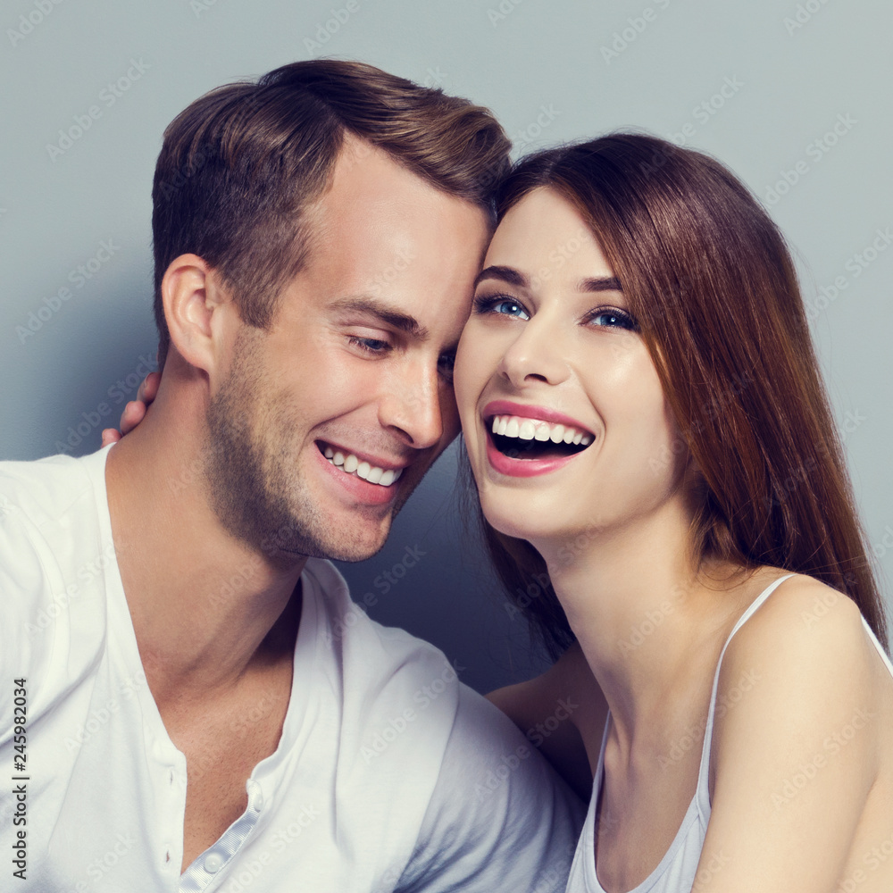 Beautiful young amorous couple, sitting on floor Beautiful young amorous couple, sitting on floor
