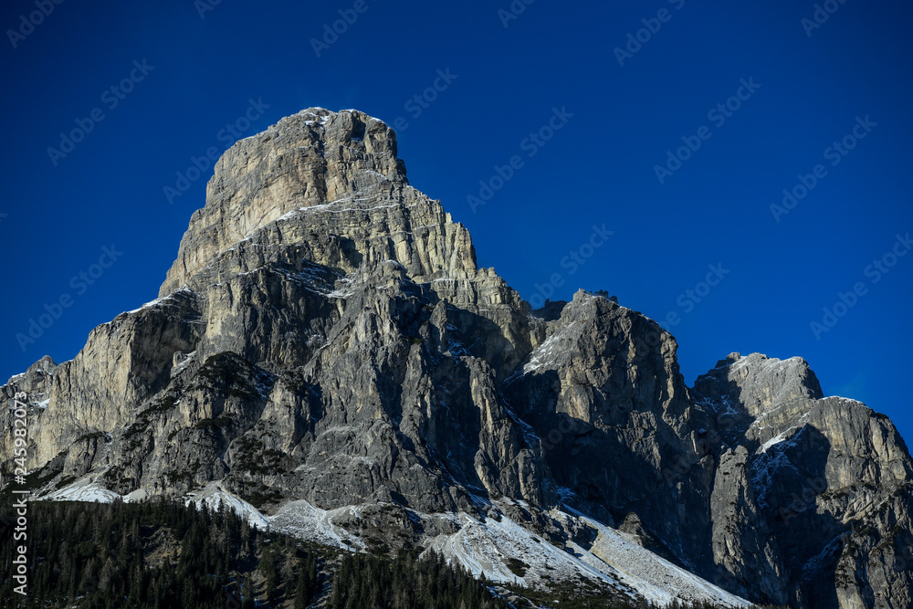 Sassongher peak seen from Corvara in Badia in the Dolomites, South Tyrol, Italy. Beautiful winter sunny day Sassongher peak seen from Corvara in Badia in the Dolomites, South Tyrol, Italy. Beautiful winter sunny day