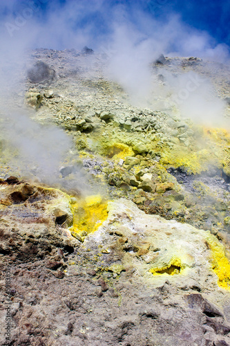 Steam of a volcanic spring with yellow sulphur at Vulcano, an Aeolian island in Sicily, Italy