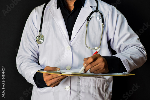doctor standing on black background. Medical and healthcare concept.