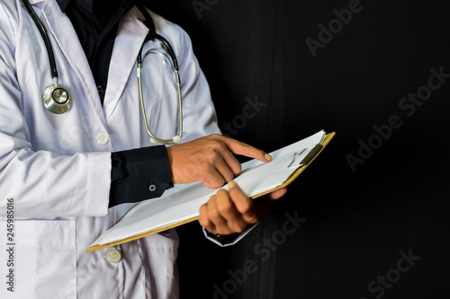 doctor standing on black background. Medical and healthcare concept.