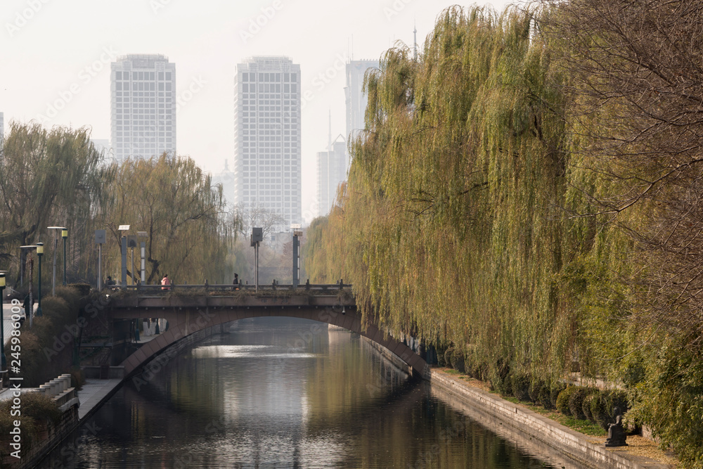 View of the river and bridge in Jinan, Shandong province, China, autumn day