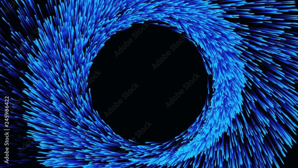 Blue abstract glitter trail flying in a spiral on black background ...