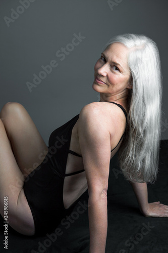 Portrait of smiling mature woman with gray hair