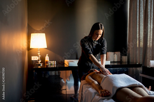 Картината върху платно Young woman having a massage