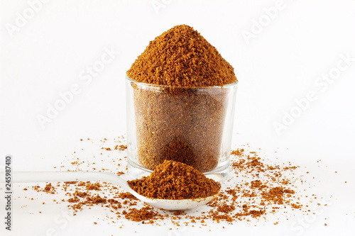 indian garam masala spices powder for vegetarian or non vegetarian cooking isolated on white background